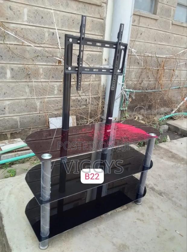 - Cool Black Executive Glass Tv Stand With Wall Mount