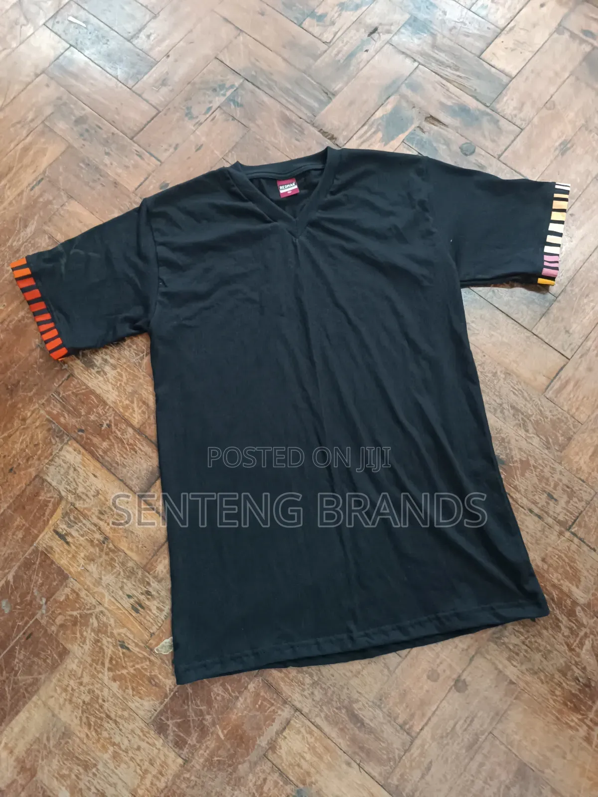 V Neck Branded With Kitenge Decorations.