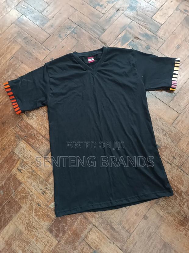 V Neck Branded With Kitenge Decorations.