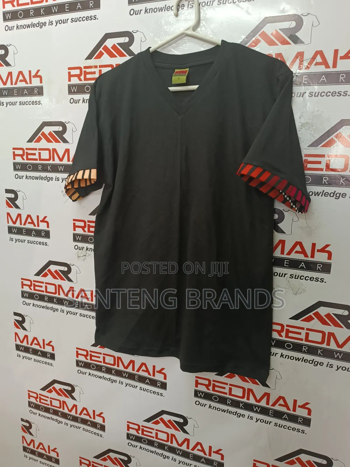 V Neck Branded With Kitenge Decorations.