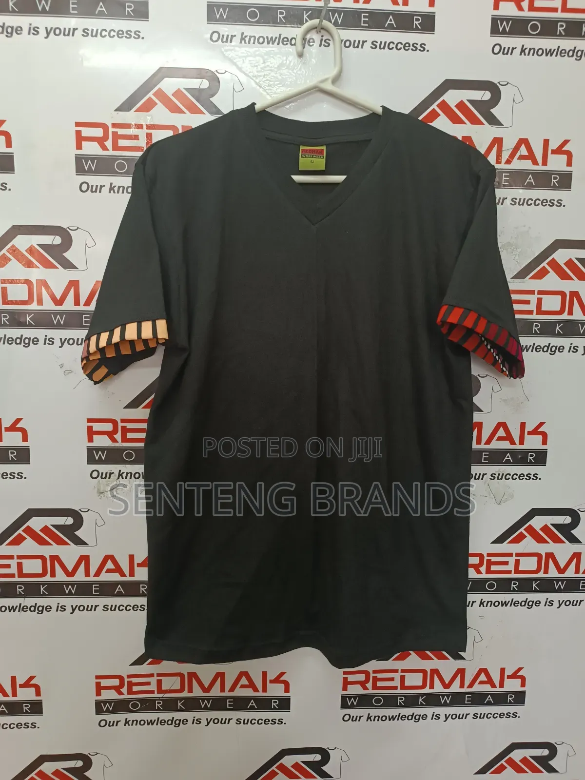 V Neck Branded With Kitenge Decorations.