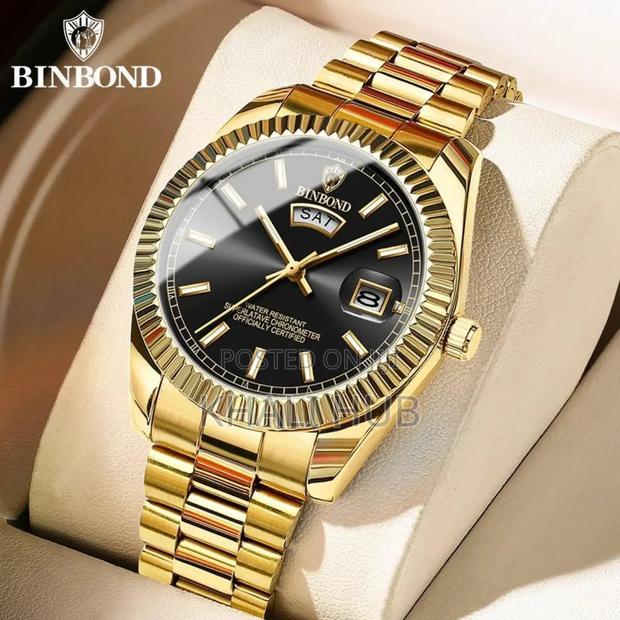 Binbond Day and Date Watch. Gold in Colour With Dark Inside