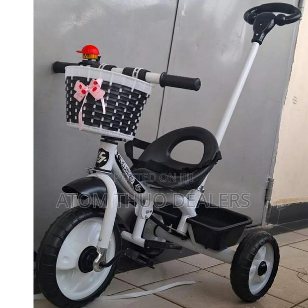 Black Tricycle With Push Handle.