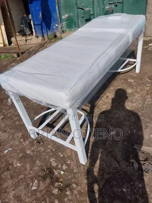 White C Stands Massage Bed