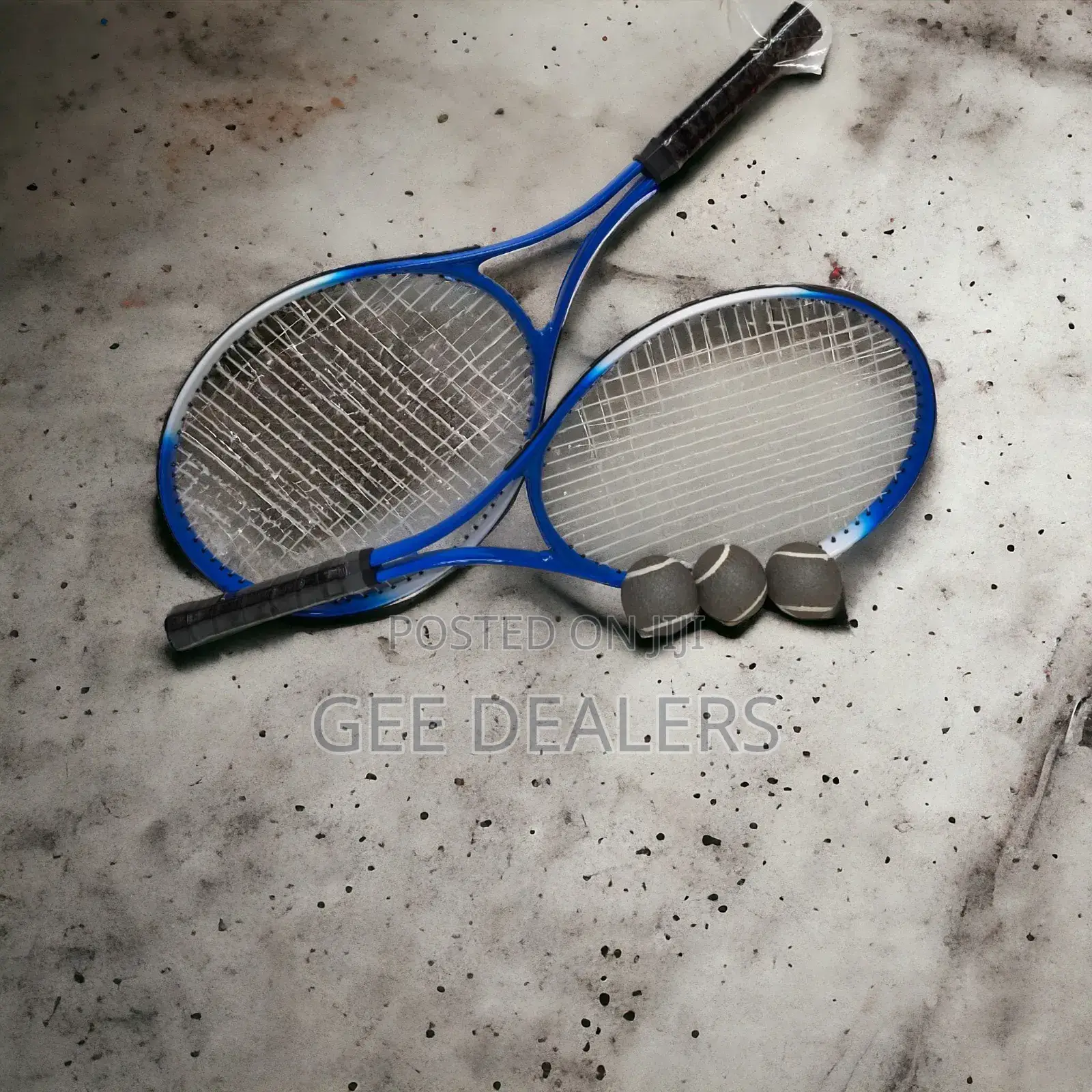 A Pair of Lawn Tennis Rackets >Tennis Rackets With Balls