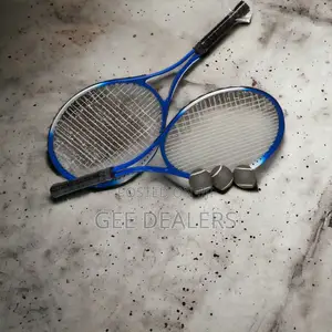 A Pair of Lawn Tennis Rackets >Tennis Rackets With Balls