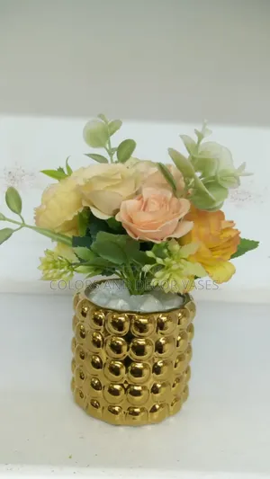 Flowered Center Piece in Gold Vase