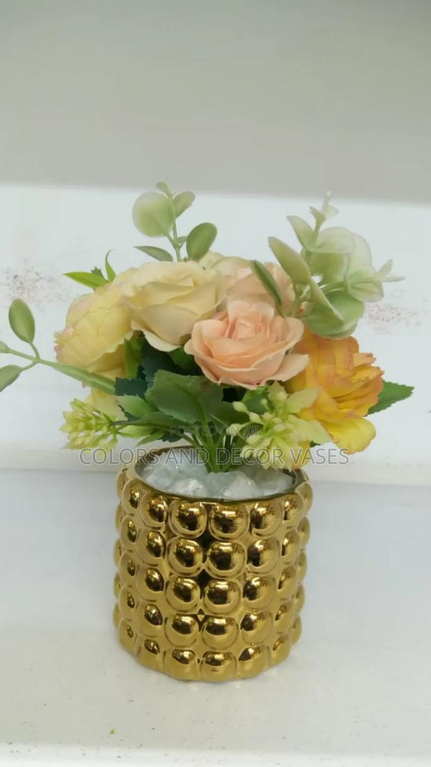 Flowered Center Piece in Gold Vase - main view