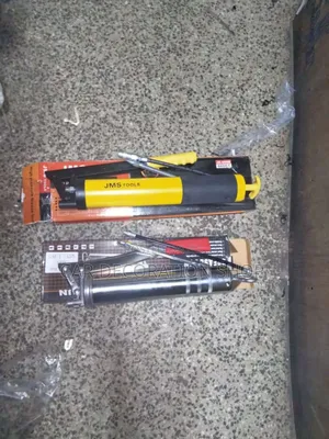 Silver and Yellow Hand Grease Gun
