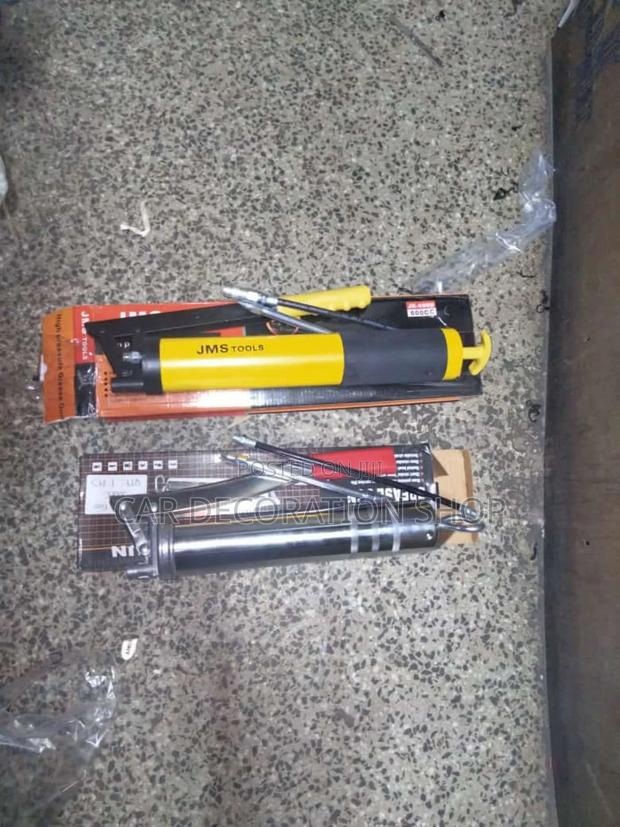 Silver and Yellow Hand Grease Gun - main view