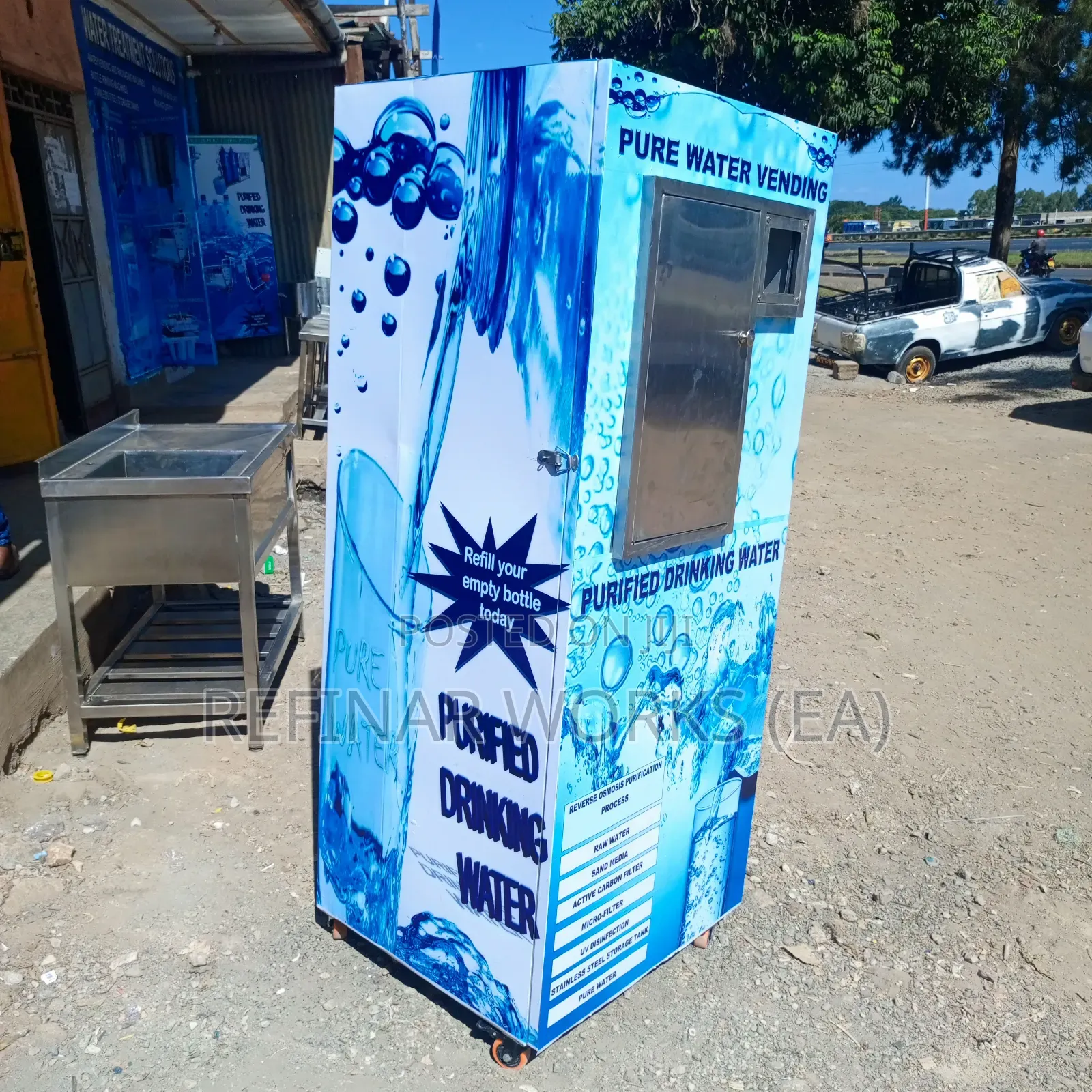 Water Vending Cabinet. Simple Wall Mounted. Accepts Coins.