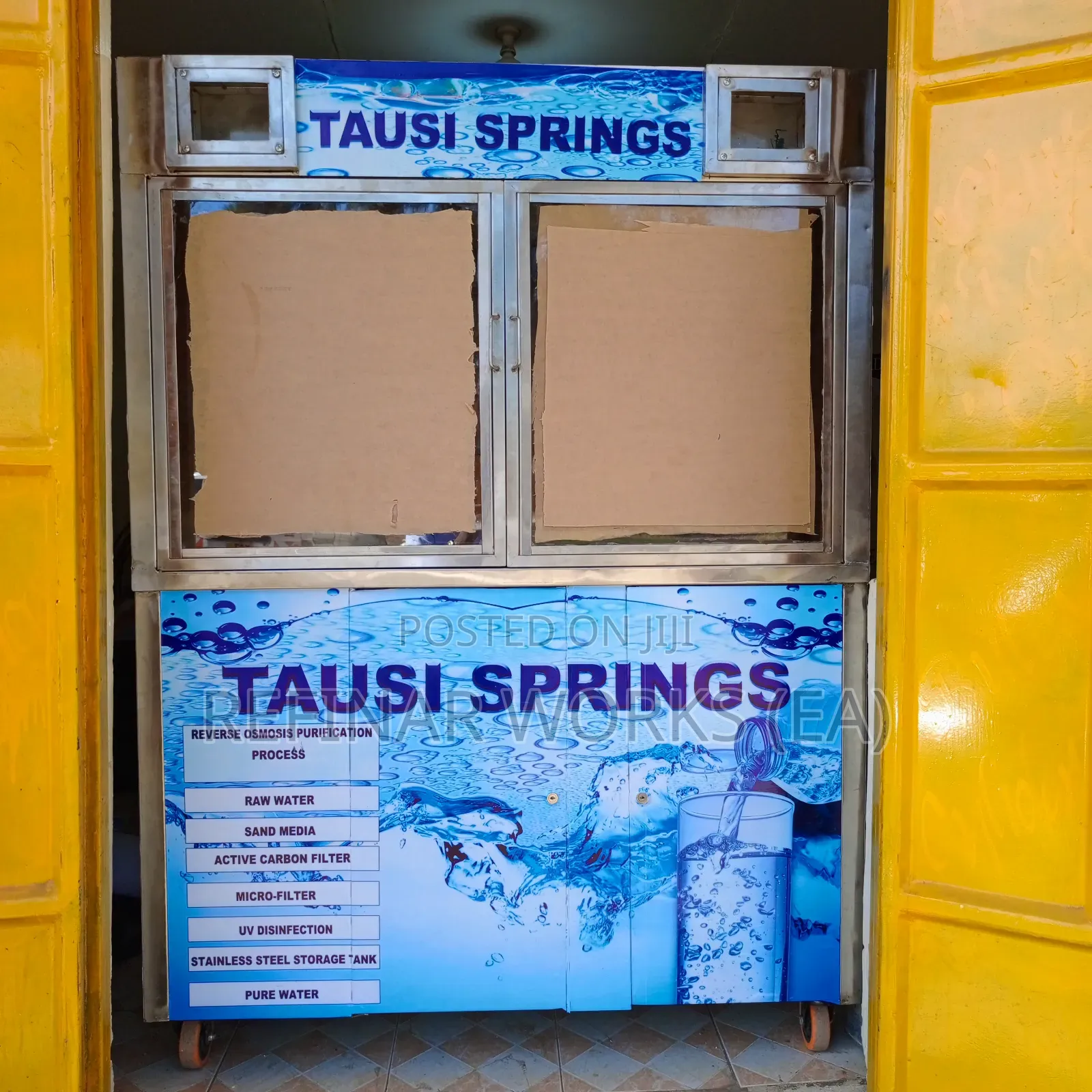 Water Vending Cabinet. Simple Wall Mounted. Accepts Coins.