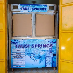 Water Vending Cabinet. Simple Wall Mounted. Accepts Coins.