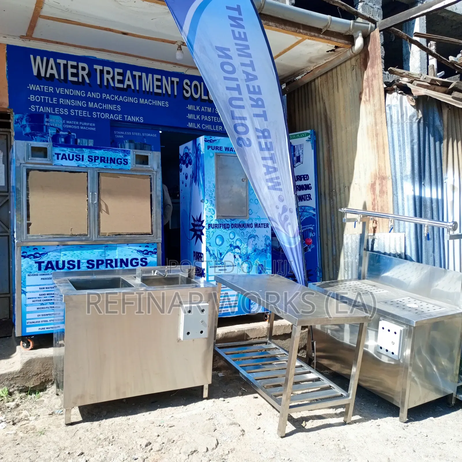 Water Vending Cabinet. Simple Wall Mounted. Accepts Coins.