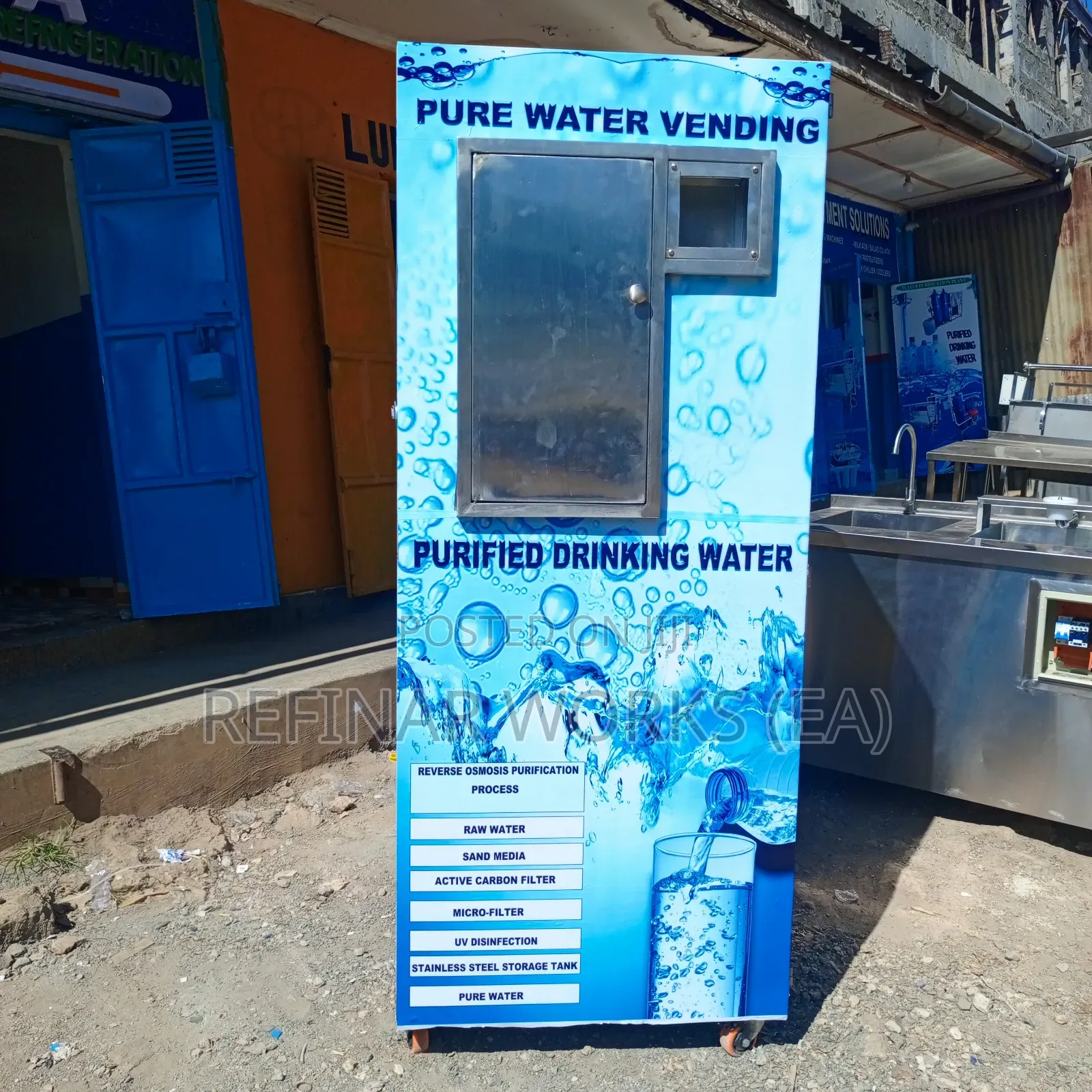 Water Vending Cabinet. Simple Wall Mounted. Accepts Coins.