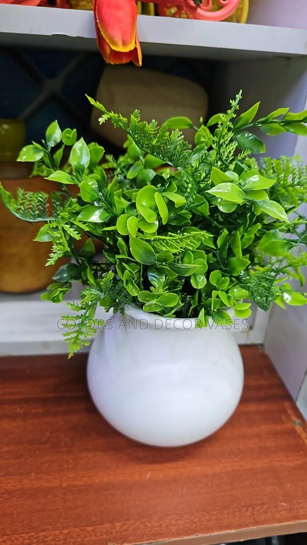 White Round Wooden Vase and Flowers