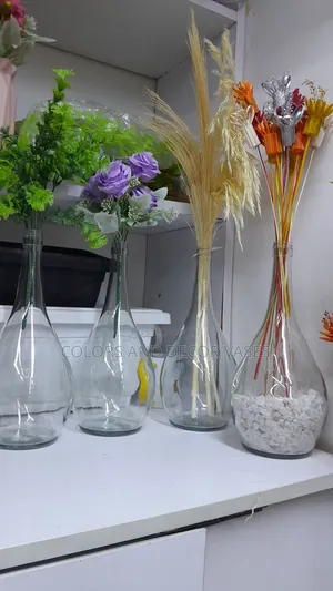 Glass Round Vase With Flowers And Pebble Stones