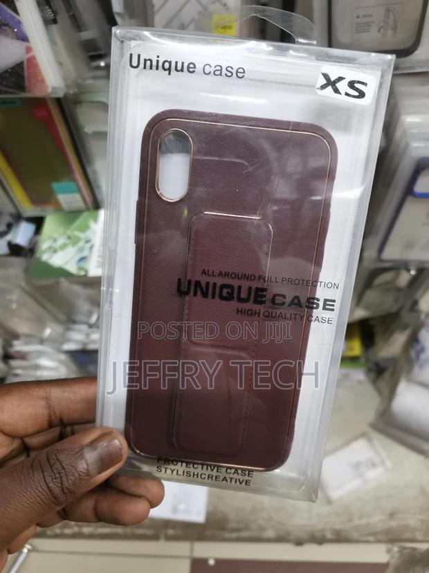 Maroon iPhone XS Leather Wrist Strap Case With Stand - main view