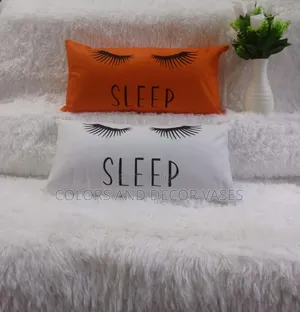 Sleep Orange and White Pillows