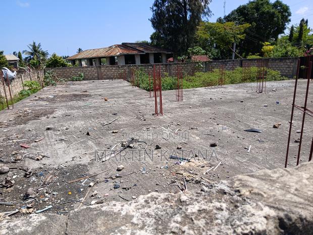 Block Fenced and Gated Plot, With Basic Building Foundation - main view
