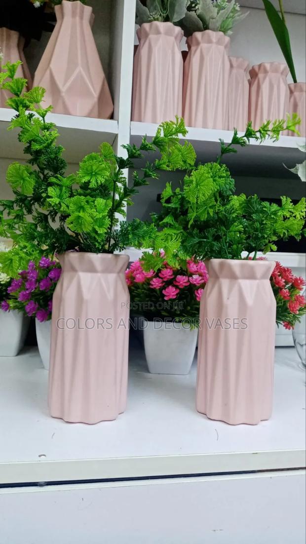 Green Flowers With Pink Vases