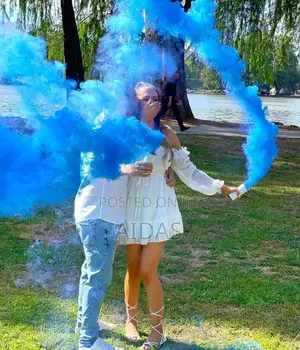 A Boy or a Girl Gender Reveal Color Smokes