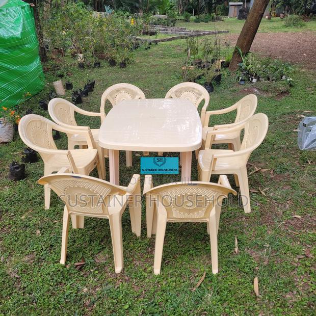 8 Plastic Chairs and a Rectangular Plastic Table Set - main view
