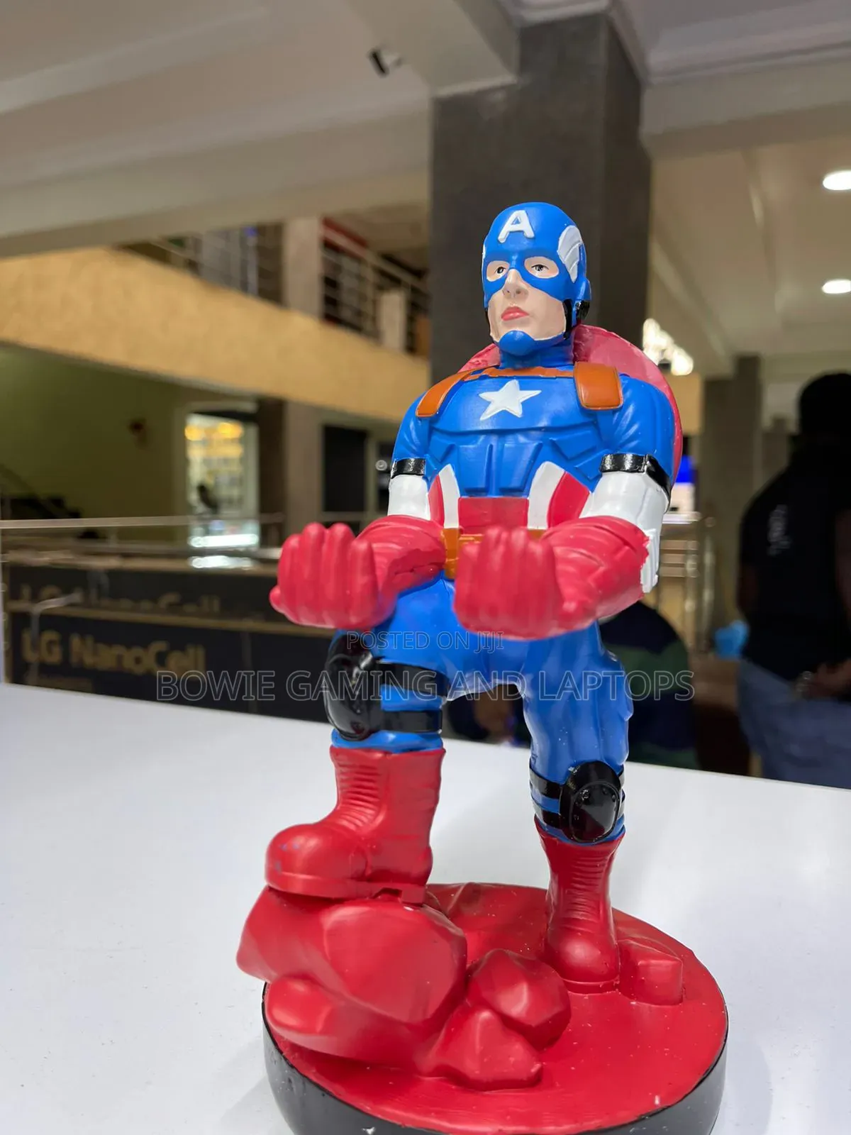 Game Controller Holding Statue Captain America