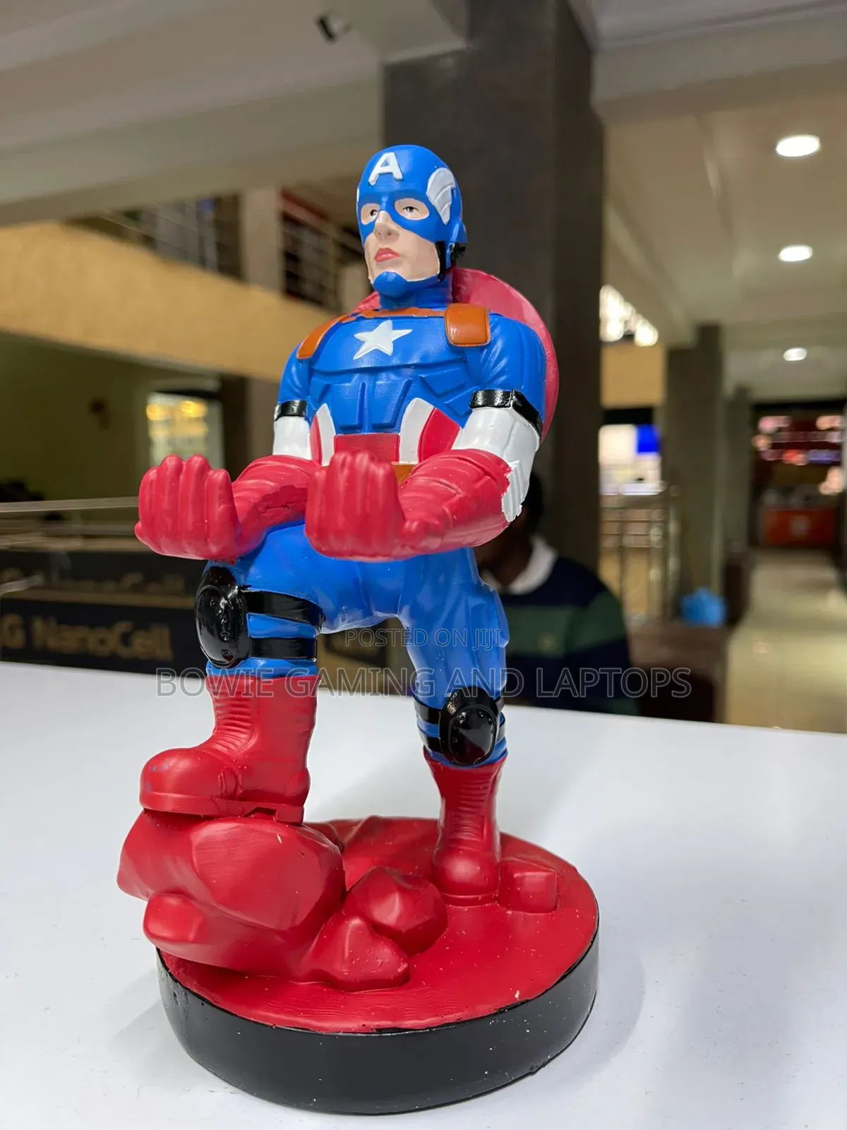Game Controller Holding Statue Captain America