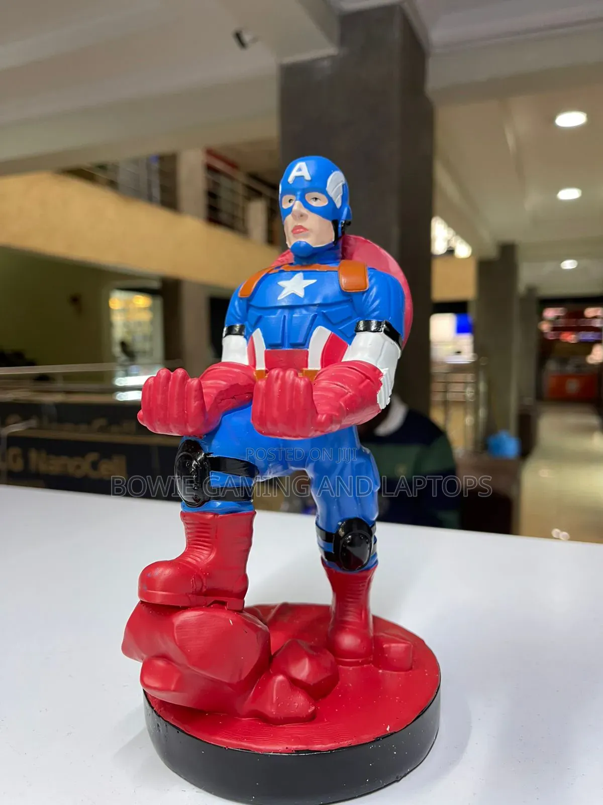 Game Controller Holding Statue Captain America