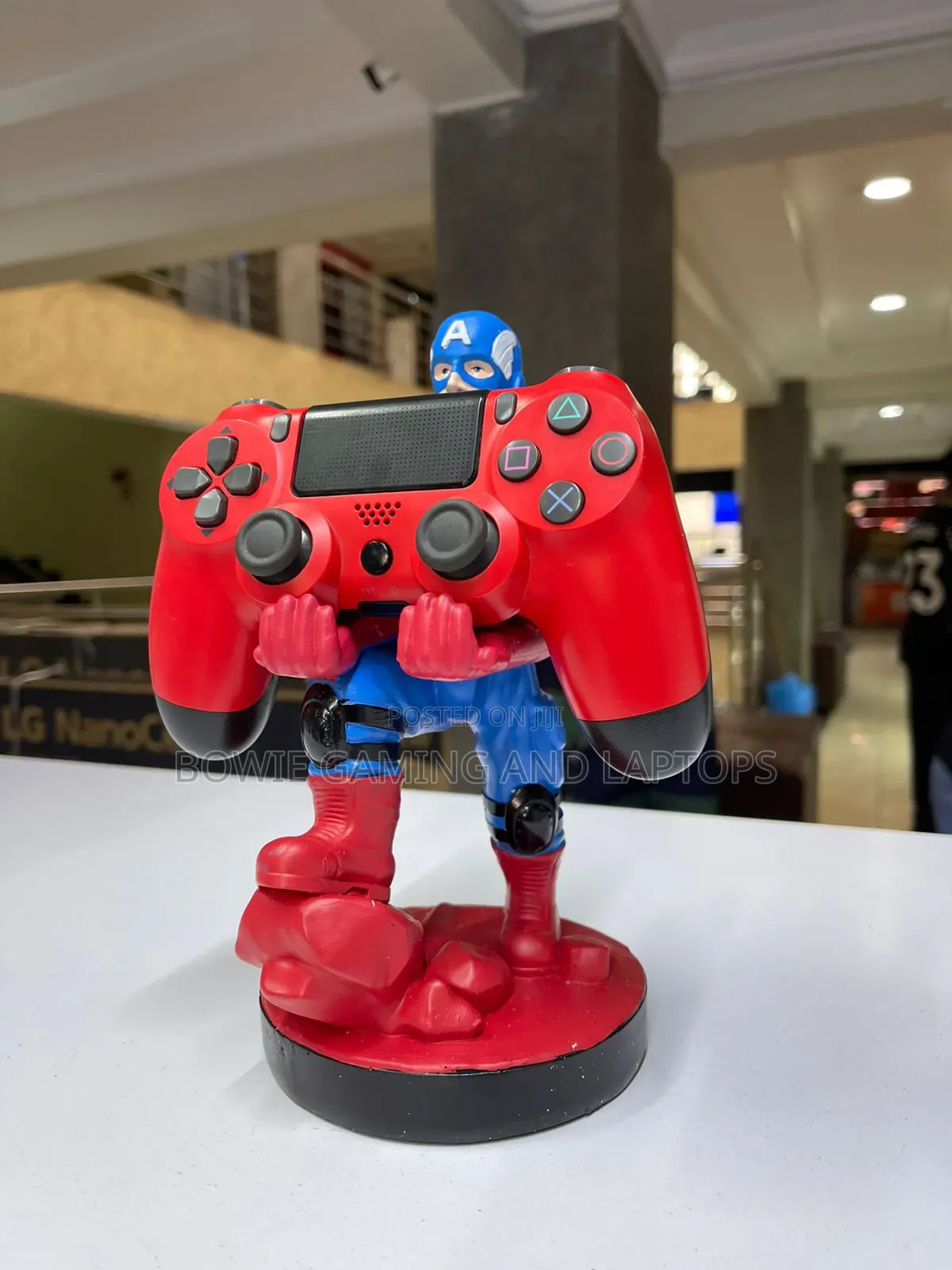 Game Controller Holding Statue Captain America