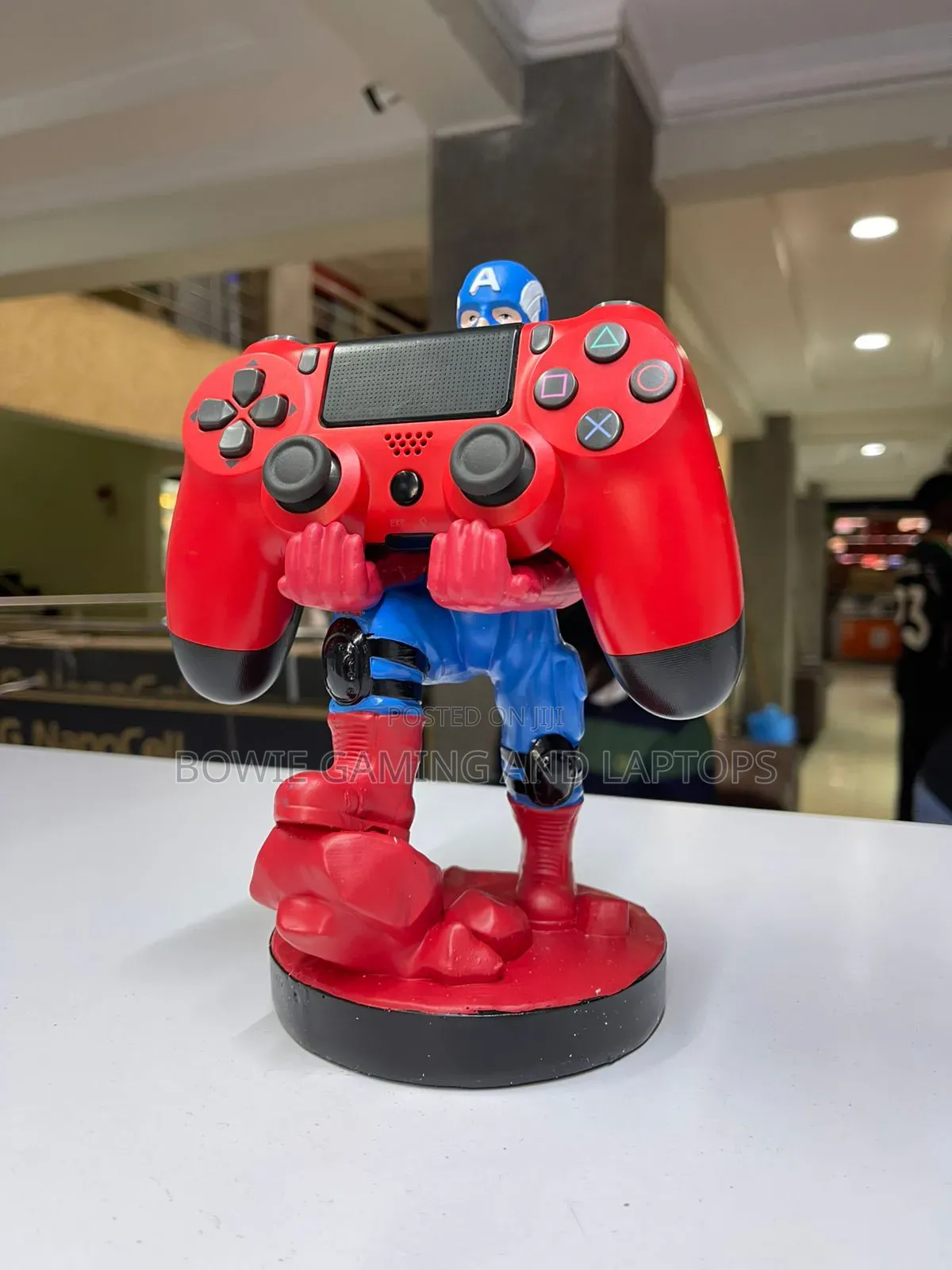 Game Controller Holding Statue Captain America