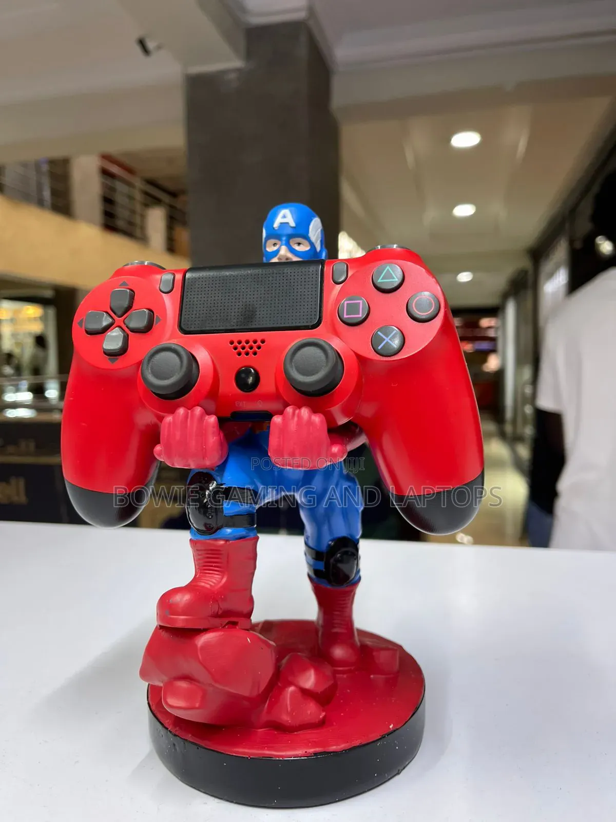 Game Controller Holding Statue Captain America