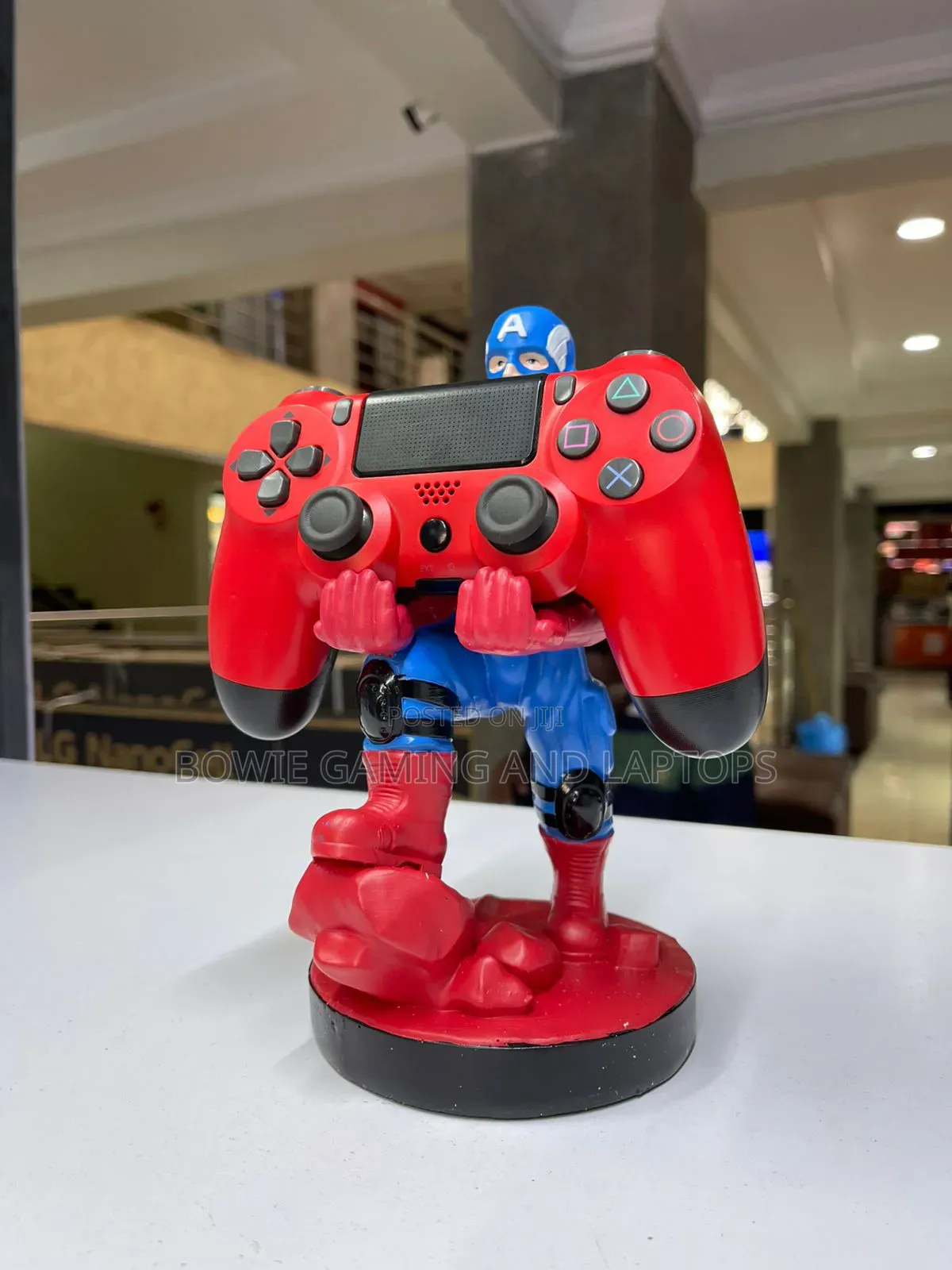 Game Controller Holding Statue Captain America
