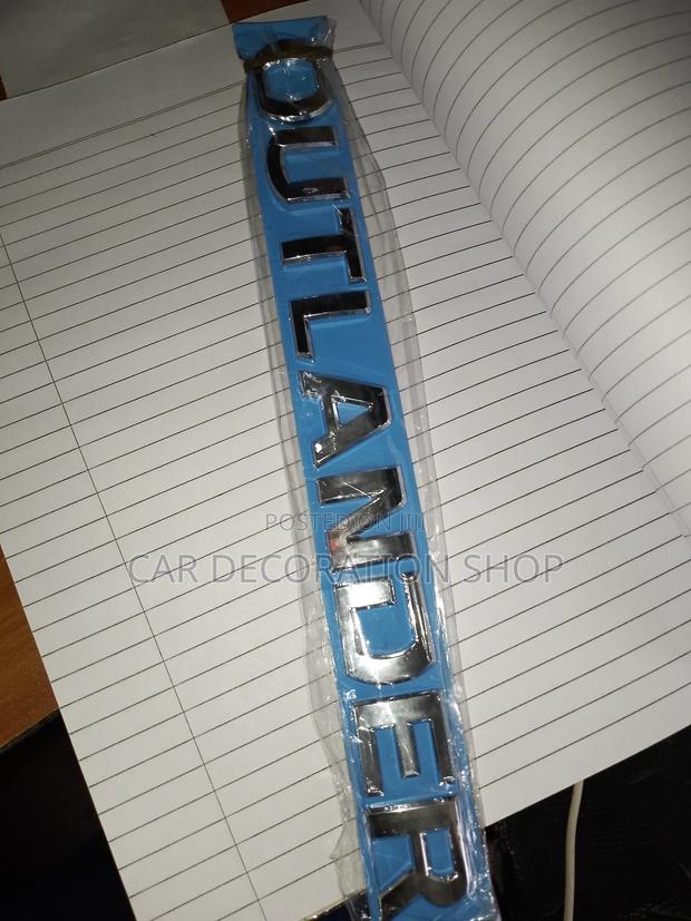 Outlander Silver Lettering Badge - main view