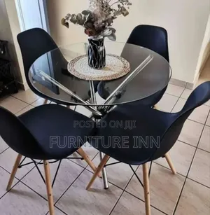 Round Glass Table + 4 Eames Chairs