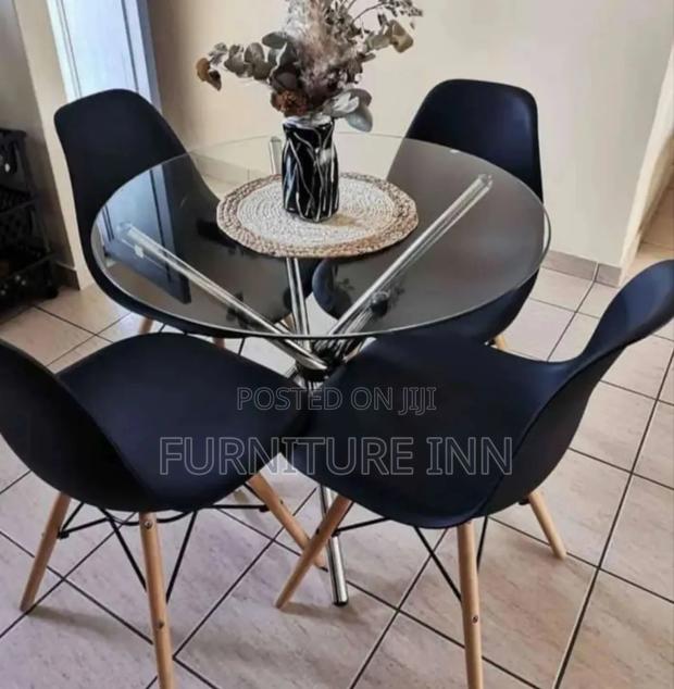 Round Glass Table + 4 Eames Chairs