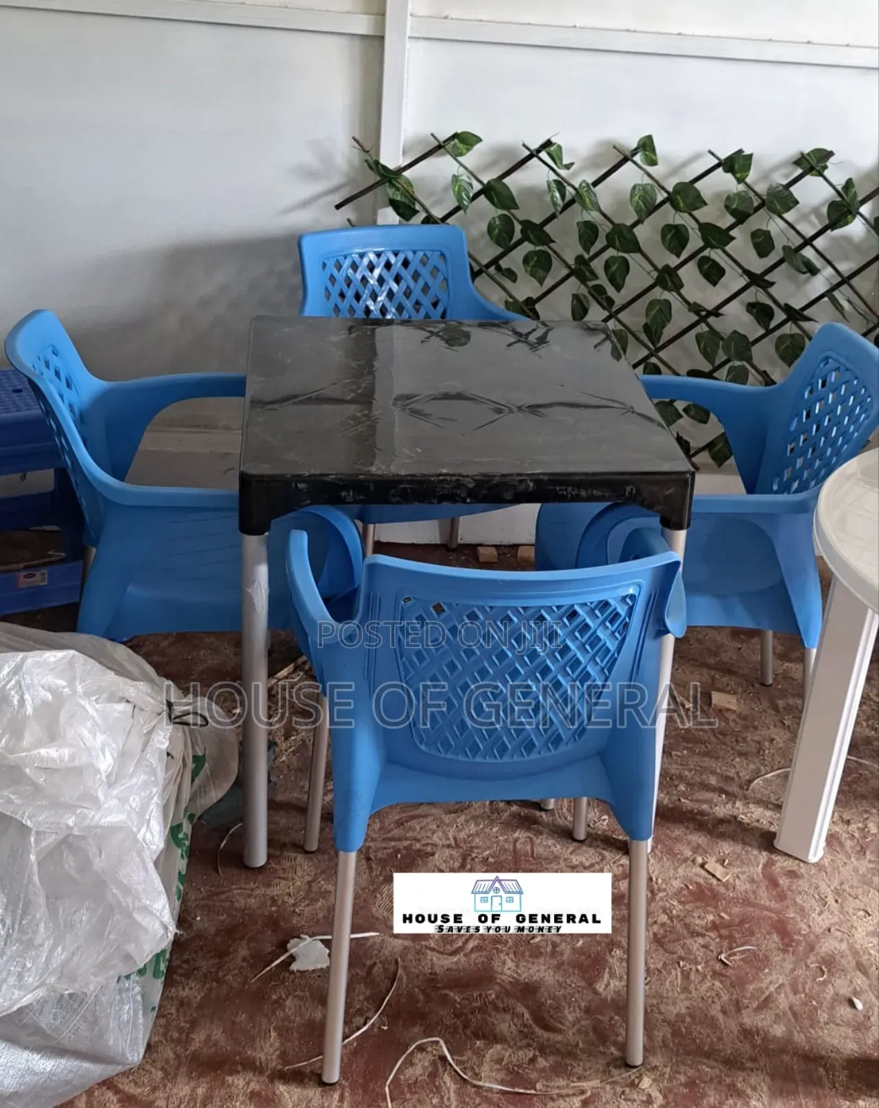 4 Blue Plastic Chair And1 Plastic Table With Metal Legs