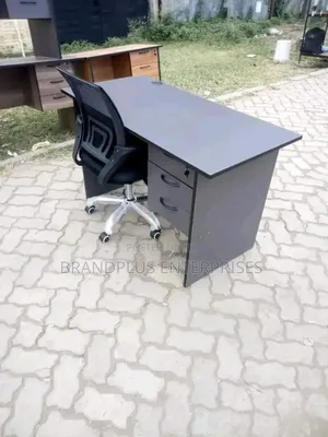 Black Secretarial Chair and Gray Office Desk
