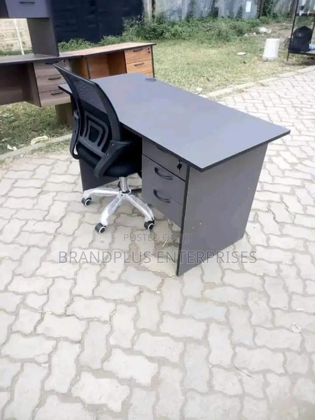 Black Secretarial Chair and Gray Office Desk