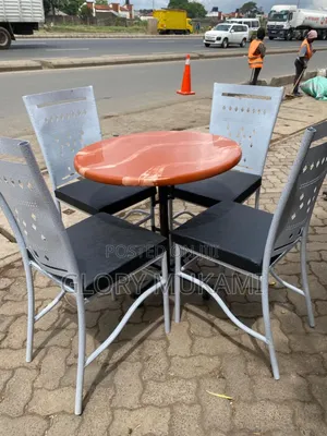 Brown Round Table and Restaurant and Bar Chairs