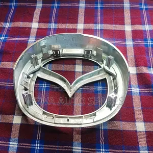 Grill Logo Mazda Demio