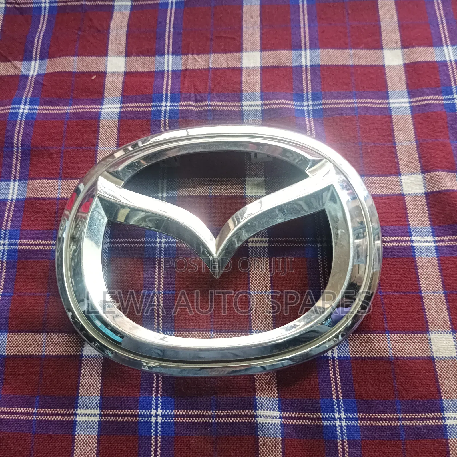 Grill Logo Mazda Demio