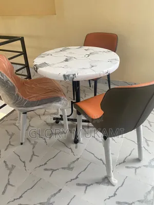 Restaurants Chairs and Round Marble Table