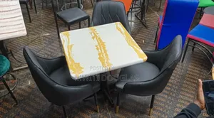 3 Sofa Seats With a Rectangular Restaurant Table
