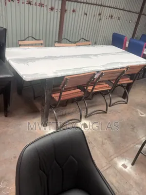 Whitish Marble Top Table With Six Seats