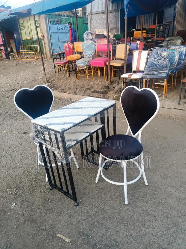 Manicure Set, Marble Table, Black and White Love Seats - main view