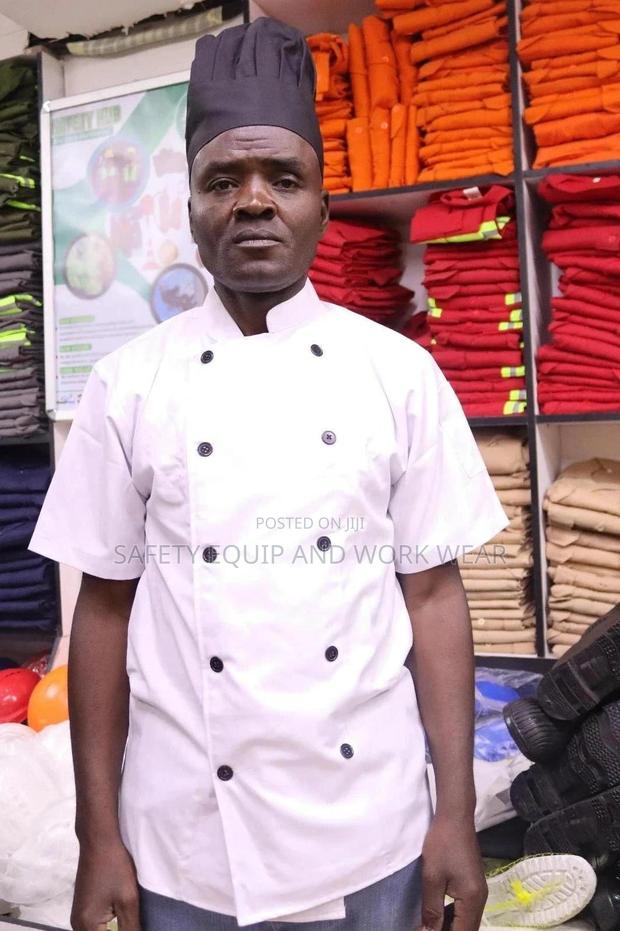 White Chef Jacket With A Black Cap