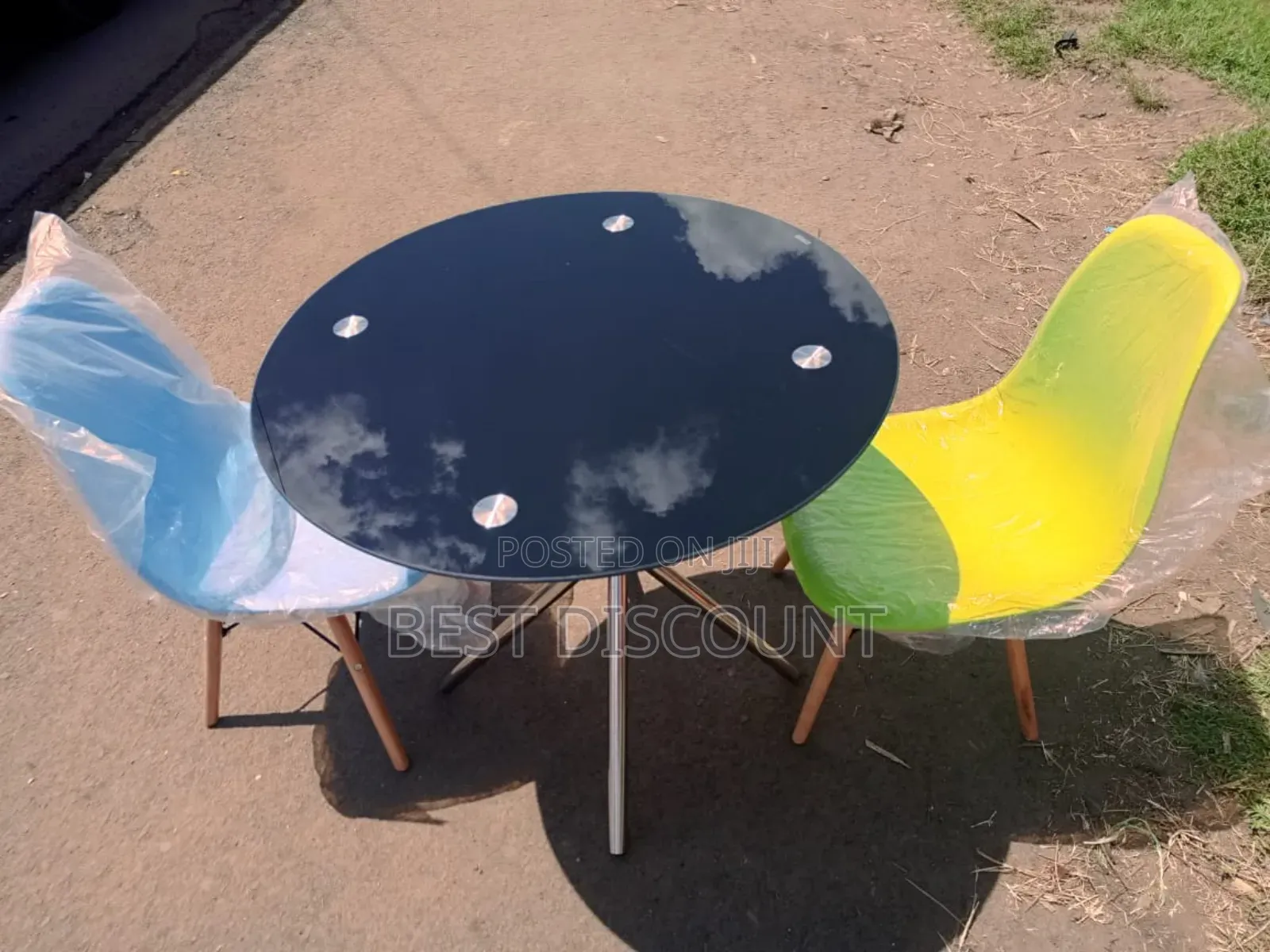 Black Table and Multi - Colored Chairs