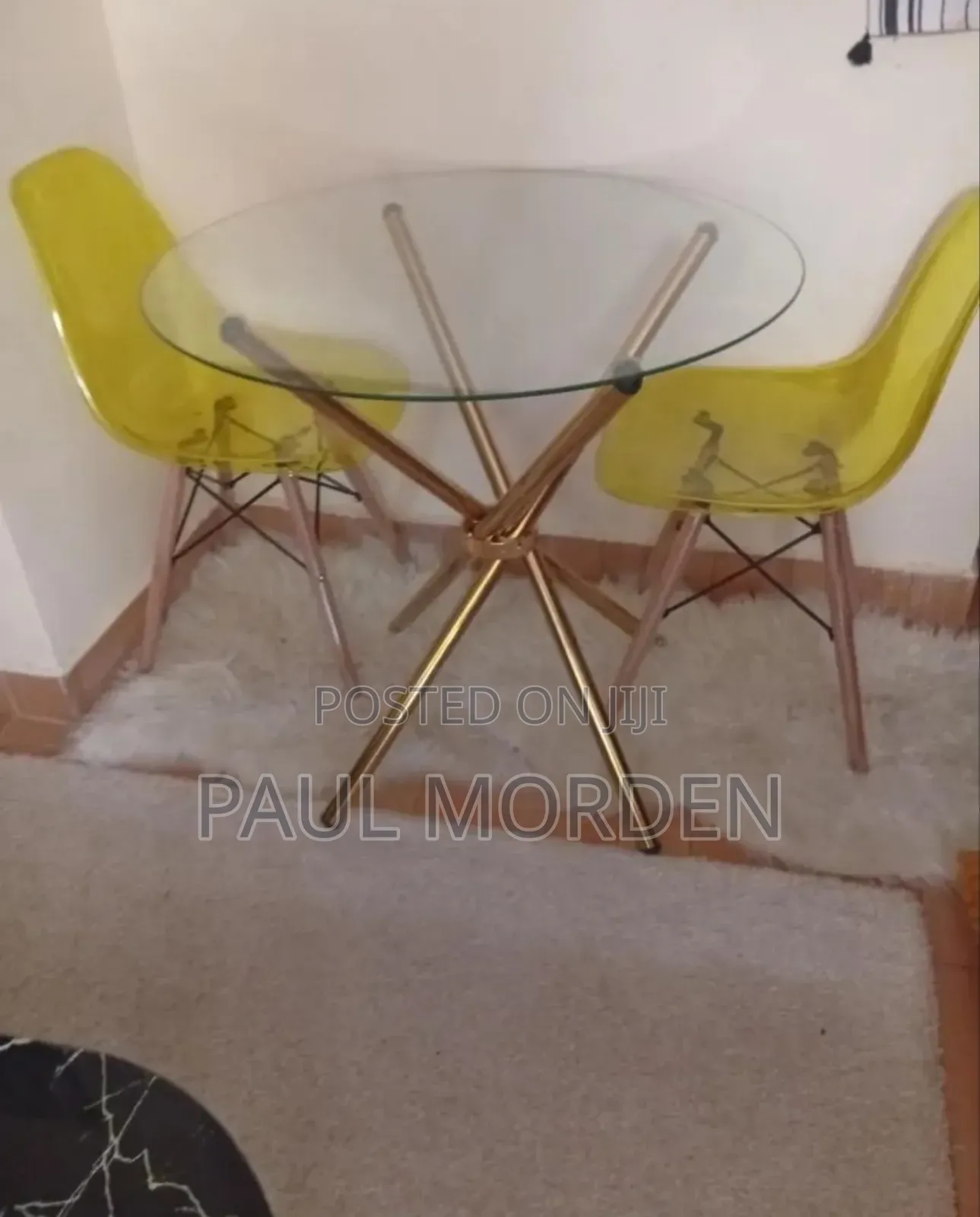 Outdoor Dining Table With Gold Stands and Two Dining Chairs